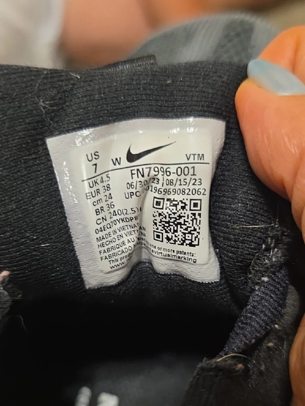 Nike Black and White Athletic Sneakers with Orange Accent